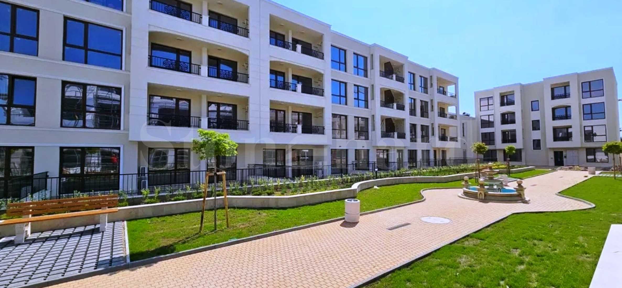 New apartments in a complex with a large landscaped yard near the park 