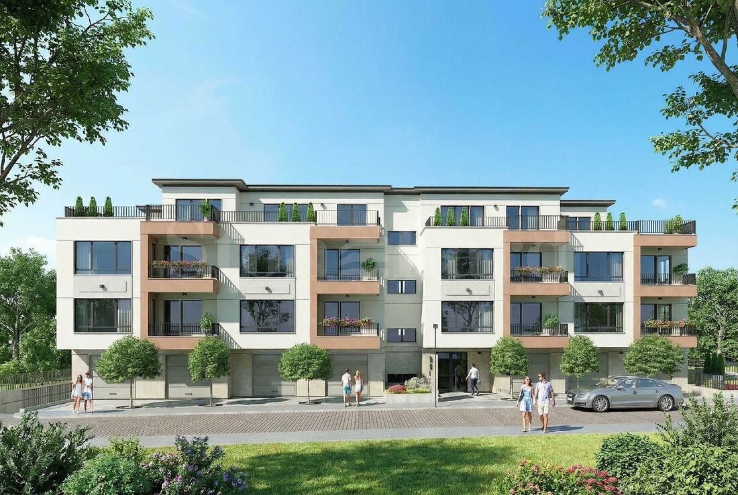 Multi-family residential building with a landscaped yard and various types of apartments in the 